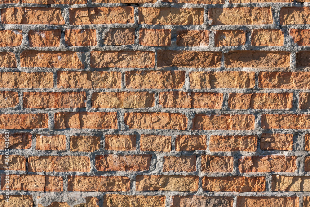 Brick wall texture background with red damaged old surface 