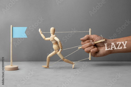 Fotografie Laziness is an obstacle on the way to the goal