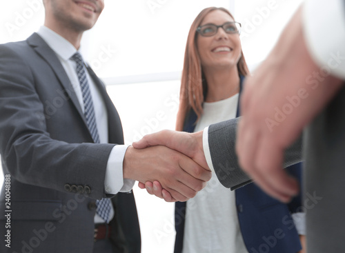 Business shaking hands in the office © ASDF