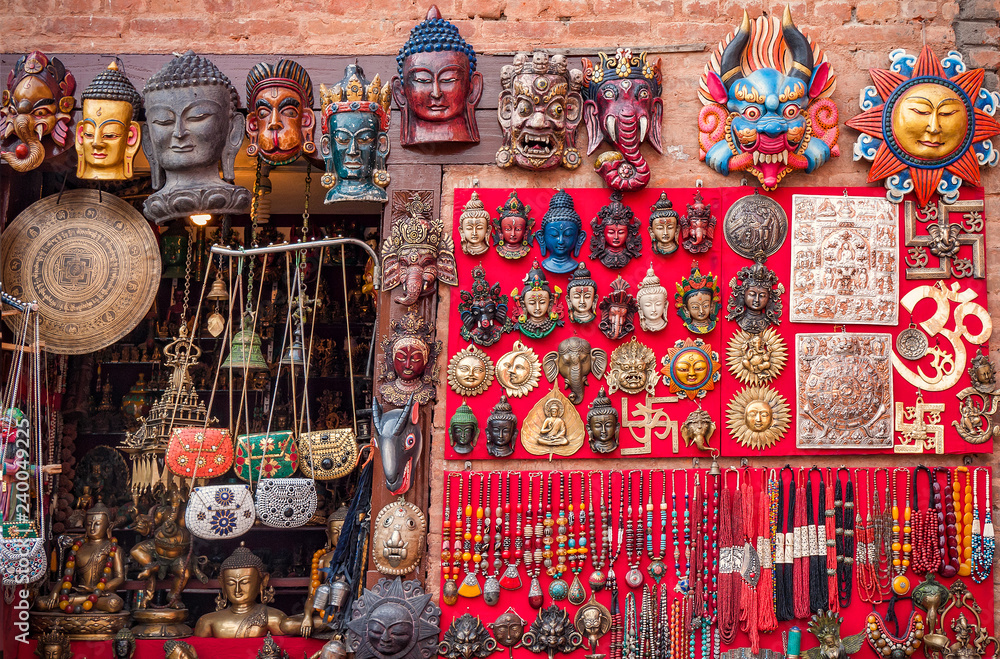Colorful carved wooden masks and handicrafts on the traditional market in Thamel District of Kathmandu, Nepal