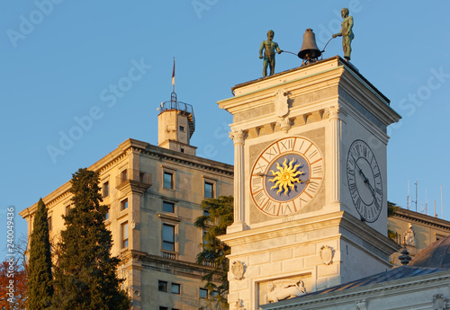 Foto Clock Tower and the Castle at Sunset in Udine