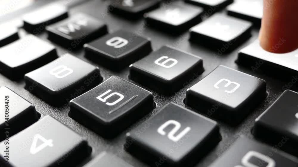 Fingers press the buttons on the calculator. Count on the calculator. The numbers are drawn on the buttons. Accounting and business income. Fingers press the buttons on the calculator. Count on the calculator. The numbers are drawn on the buttons. Accounting and business income.