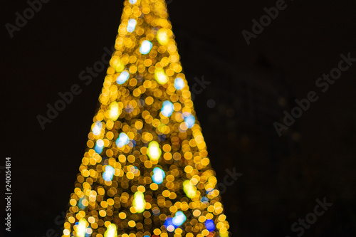 Abstract new year tree background, decorated with classical toys and illuminated with led lights