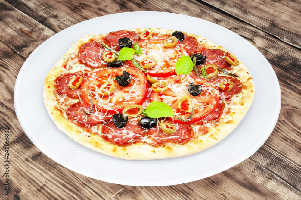 Pizza on wooden background