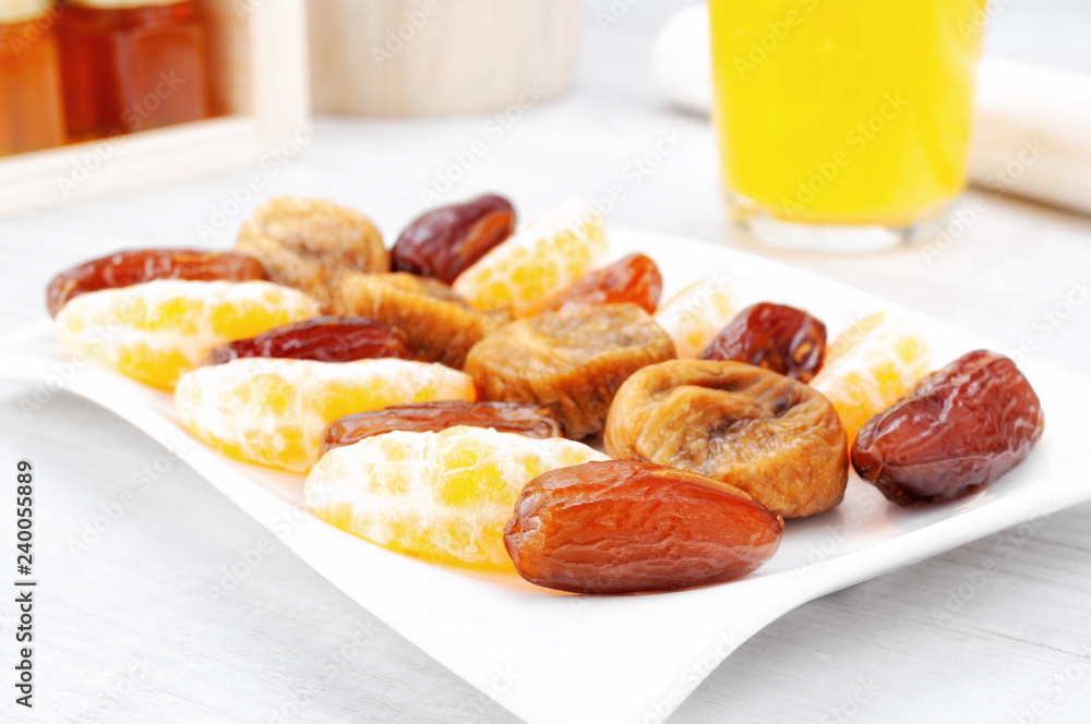 Dried dates fruit on wooden table