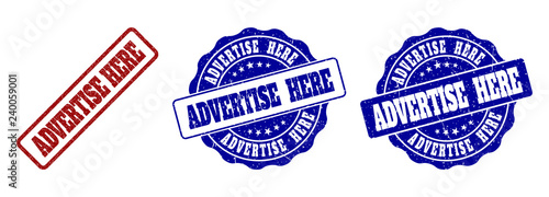 ADVERTISE HERE grunge stamp seals in red and blue colors. Vector ADVERTISE HERE marks with grunge style. Graphic elements are rounded rectangles, rosettes, circles and text titles.
