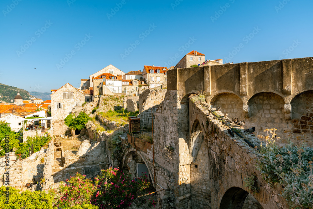 The old walls and the houses of Dubrovnik on daylight