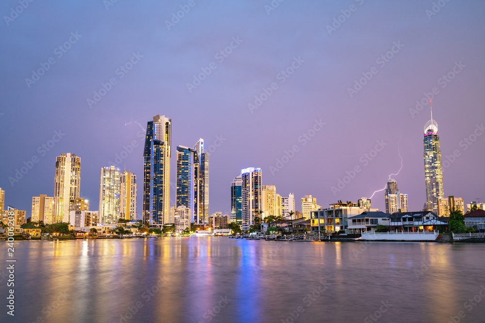 Fototapeta premium The Gold Coast Arts Centre with a view of Surfers Paradise at sunset with amazing sky and reflections