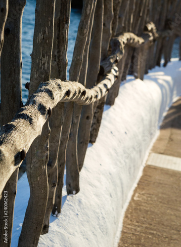 View of a typical wooden fence of the fishing village Binibeca Menorca Spain photo