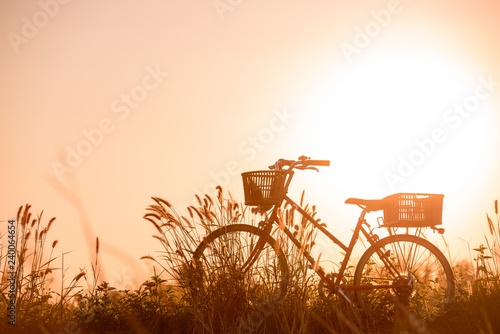 Fototapeta Naklejka Na Ścianę i Meble -  beautiful landscape image with Bicycle at sunset
