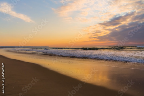 Waves and reflection at sunset