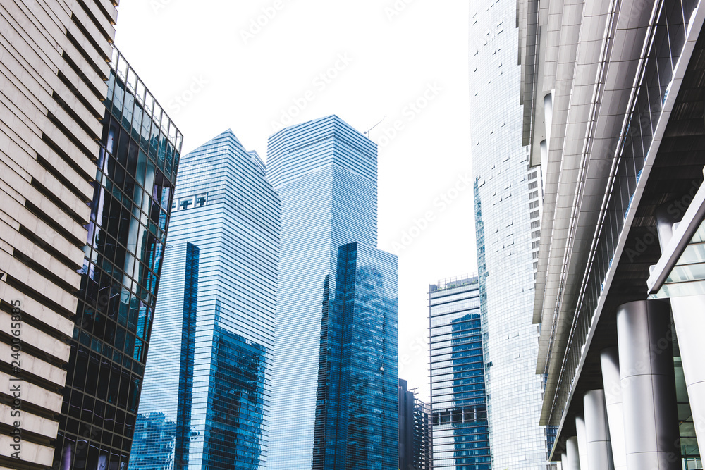 common Modern business skyscrapers, high-rise buildings, architecture raising to the sky, sun. Concepts of financial, economics, future etc. common Modern business skyscrapers, high-rise buildings, architecture raising to the sky, sun. Concepts of financial, economics, future etc.