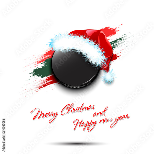 New year and hockey puck in santa hat