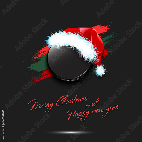 New year and hockey puck in santa hat