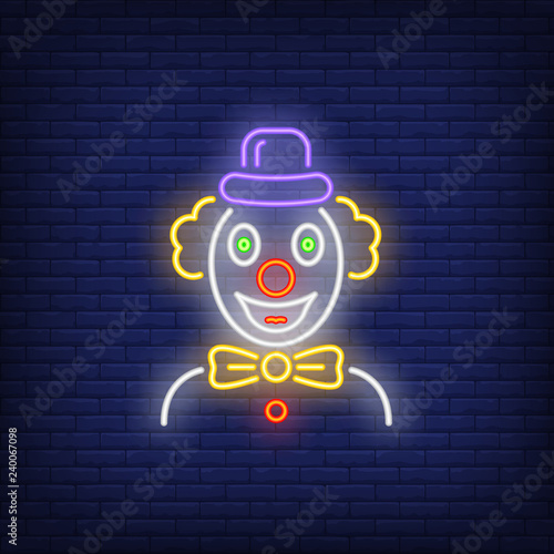Cheerful clown neon sign. Circus performance advertisement design. Night bright neon sign, colorful billboard, light banner. Vector illustration in neon style.