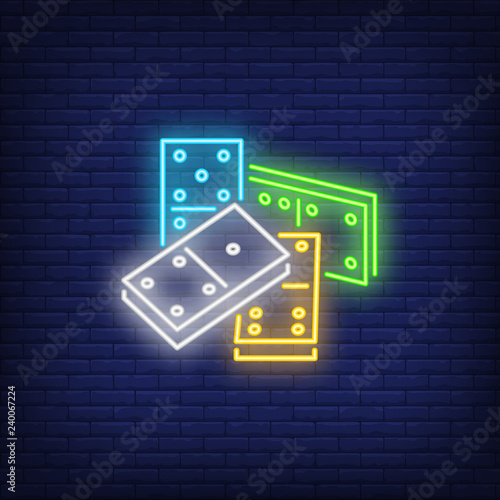 Four bright dominoes tiles neon sign. Board game and recreation design element. Night bright neon sign, colorful billboard, light banner. Vector illustration in neon style.