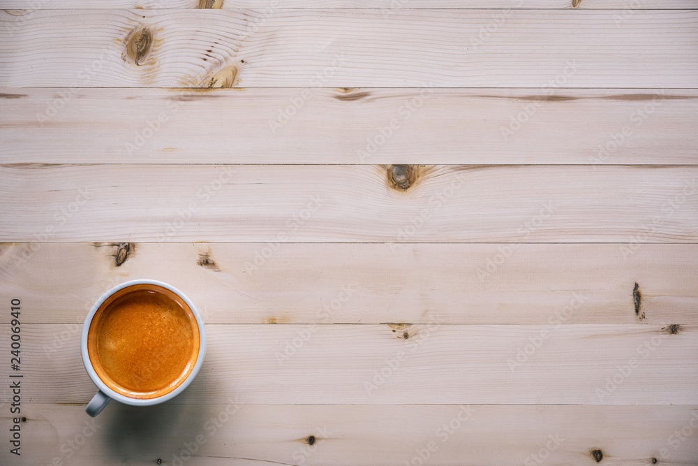 Cup of Coffee espresso  on wooden table background with copy space. top view