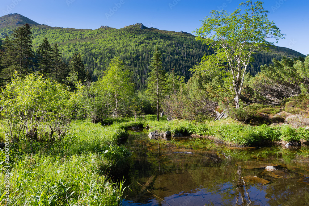 Mountains under the name Dusse Alin in Russian Far East Khabarovsk region. Beautiful mountain lake is called Seal in the mountains Dusse Alin. Mountains under the name Dusse Alin in Russian Far East Khabarovsk region. Beautiful mountain lake is called Seal in the mountains Dusse Alin.