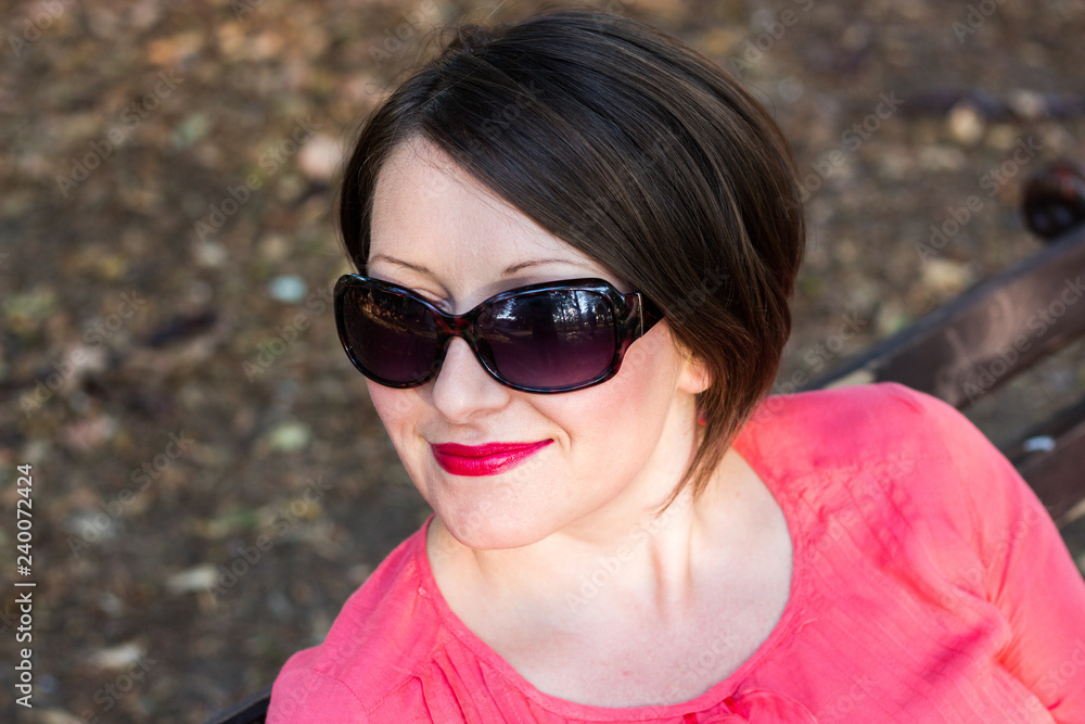 Beautiful Girl With Red Lipstick Posing on a Sunny Day Beautiful Girl With Red Lipstick Posing on a Sunny Day