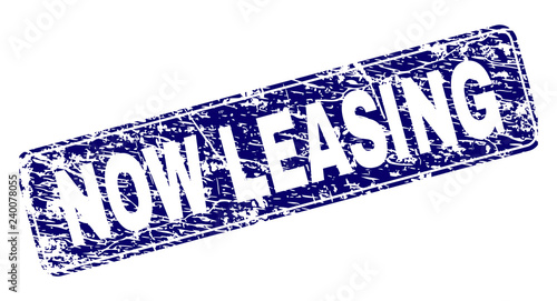 NOW LEASING stamp seal print with distress style. Seal shape is a rounded rectangle with frame. Blue vector rubber print of NOW LEASING title with dust style.