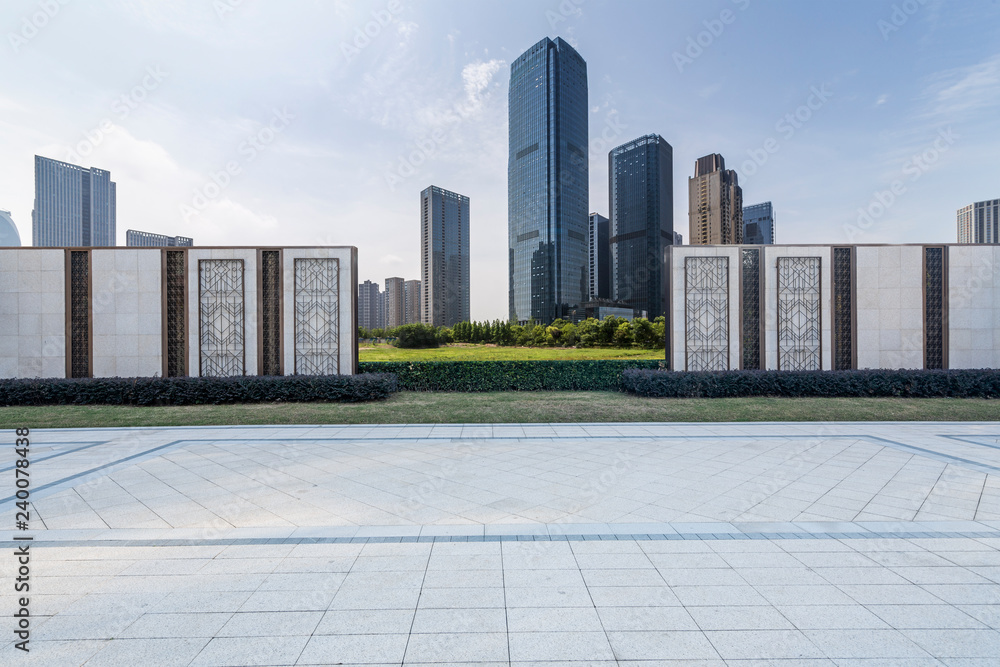 Panoramic skyline and modern business office buildings with empty road,empty concrete square floor Panoramic skyline and modern business office buildings with empty road,empty concrete square floor