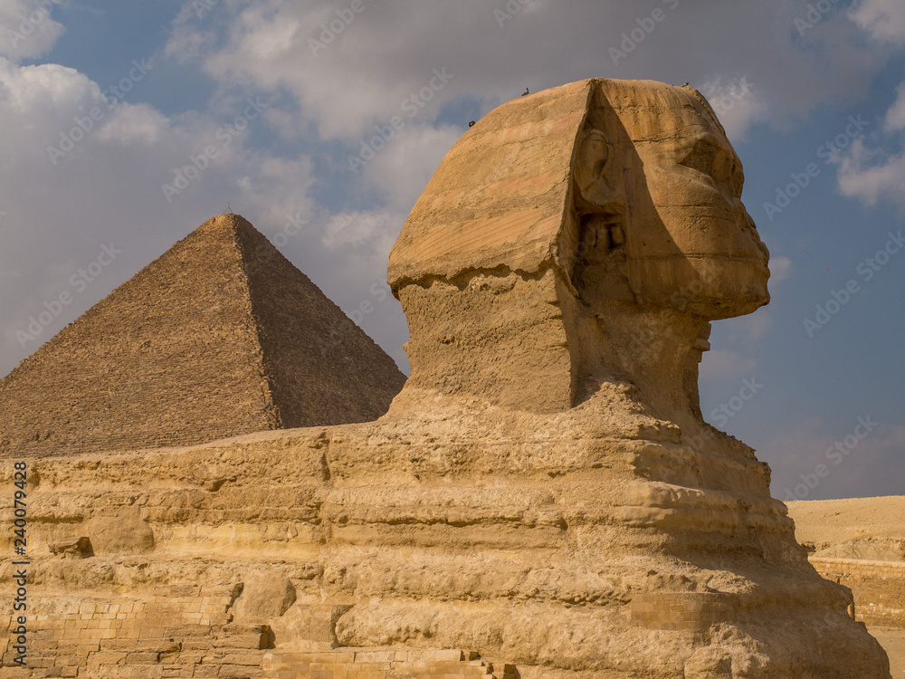 Side view of the Sphinx with the Pyramid of Khafre in Giza