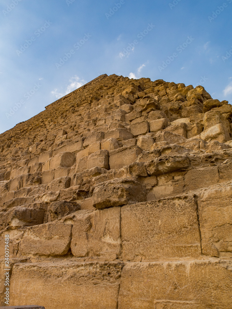 Looking up at the great pyramid of Khafre against a blue sky