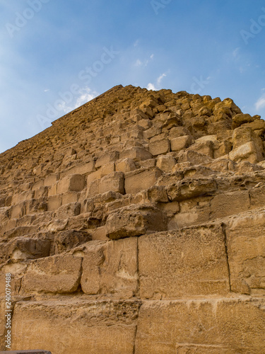 Looking up at the great pyramid of Khafre against a blue sky