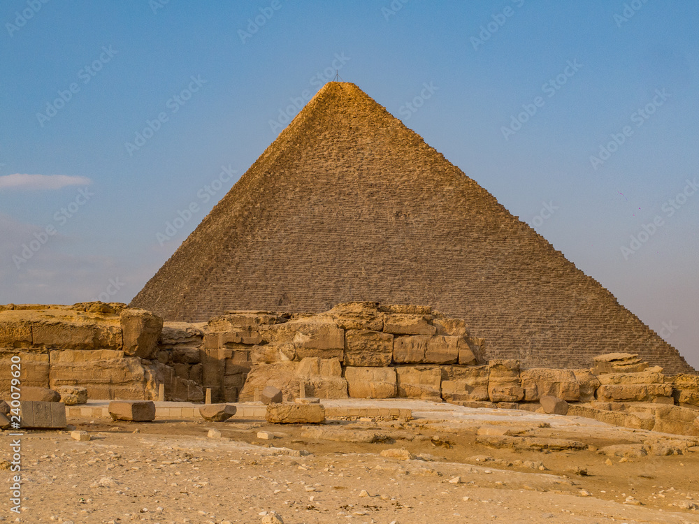 Wall of stone in front of one of the Great Pyramids in Giza Wall of stone in front of one of the Great Pyramids in Giza