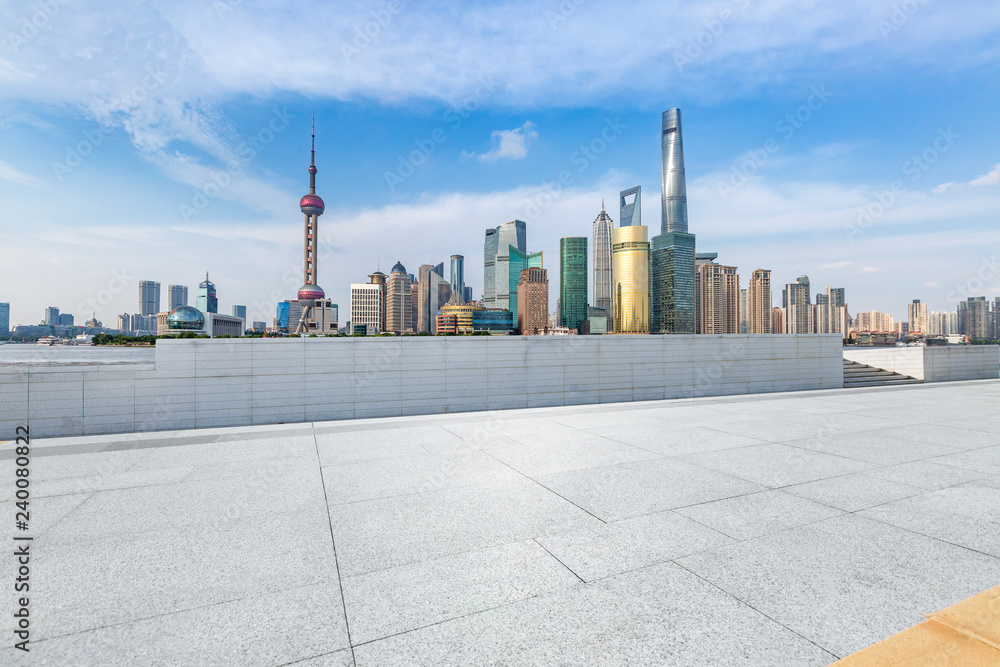 Fototapeta premium Panoramic skyline and modern business office buildings with empty road,empty concrete square floor