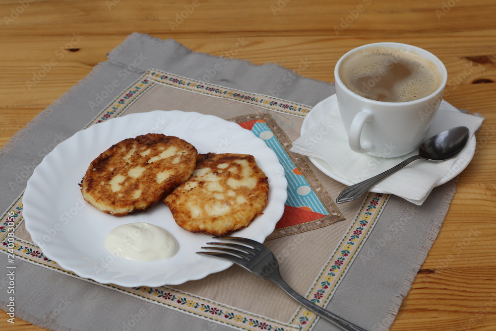 cup of coffee and croissant on wooden table cup of coffee and croissant on wooden table