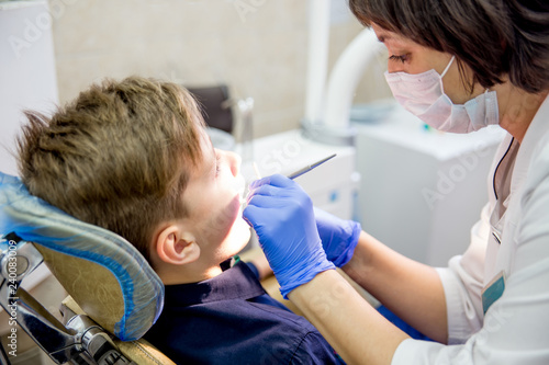 female dentist with a patient in a clinic