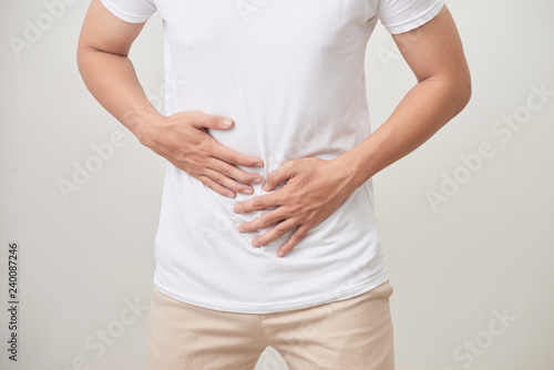 Wallpaper Mural people, healthcare and health problem concept - unhappy man suffering from stomach ache over white background Torontodigital.ca