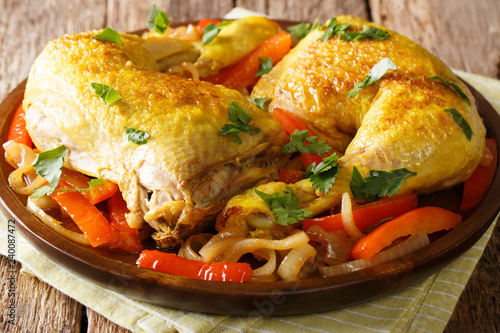 Golden chicken legs stewed with saffron close-up. Arabic cuisine. horizontal