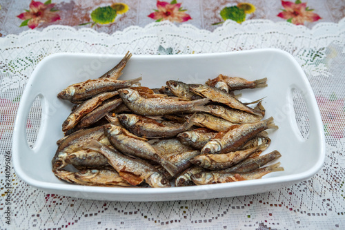 Home made food fried fish on large ceramic bowl