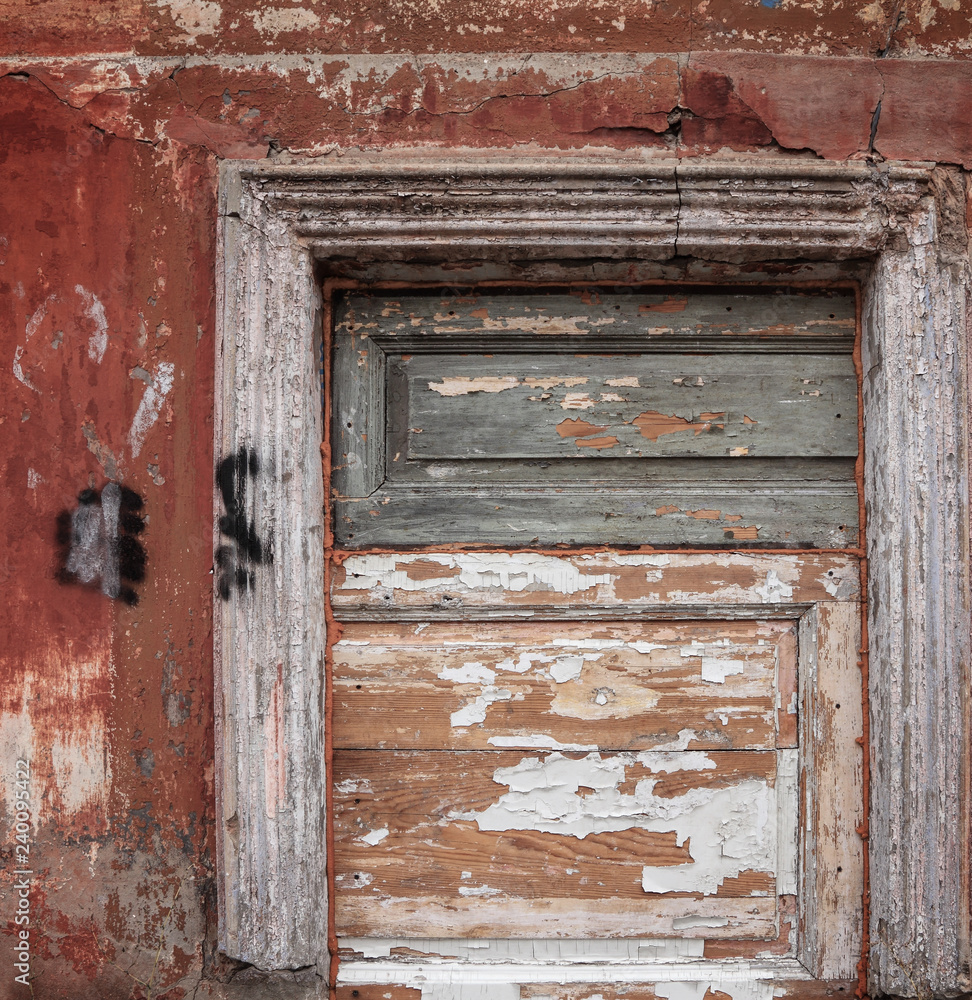 Wooden dyed boards. Wall with peeling paint of a old abandoned house. Background 