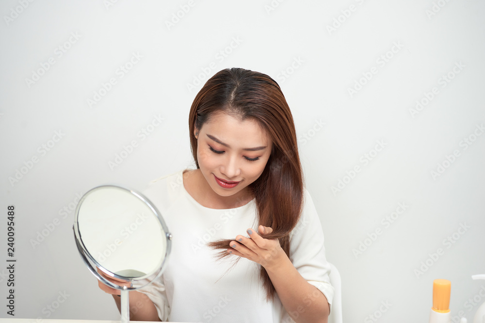 Isolated portrait of a beautiful young woman comb long hair Isolated portrait of a beautiful young woman comb long hair
