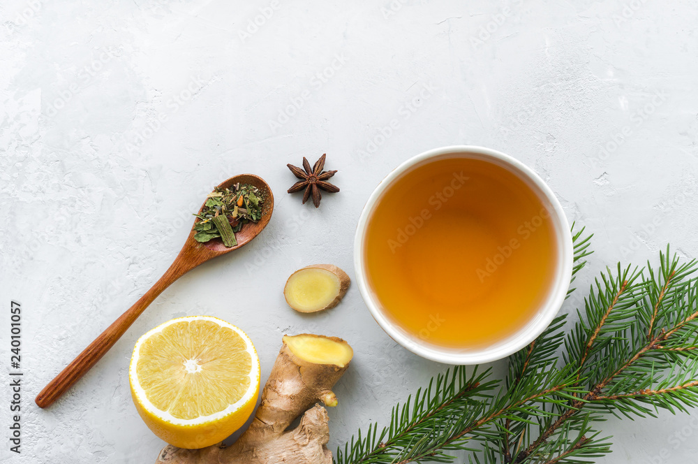 Herbal tea. Lemon, ginger and herbs on concrete table. Top view. Herbal tea. Lemon, ginger and herbs on concrete table. Top view.