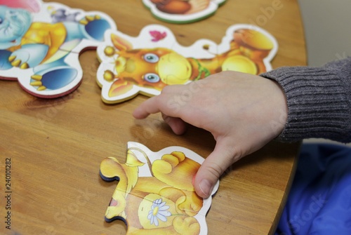 children's hands stack game puzzles