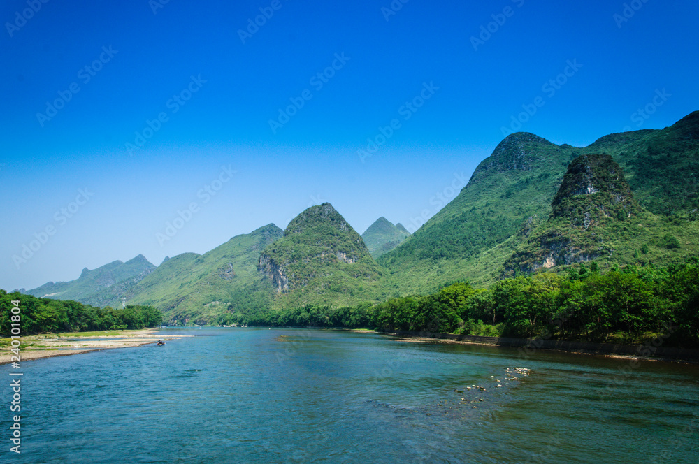 Mountains and river scenery with blue sky Mountains and river scenery with blue sky