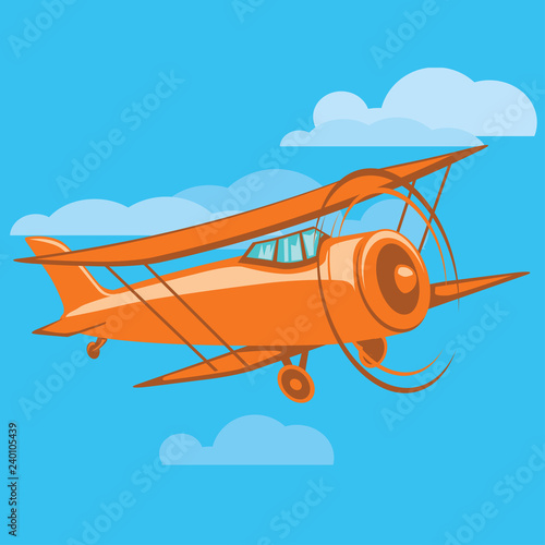 Flying vintage biplane in the sky