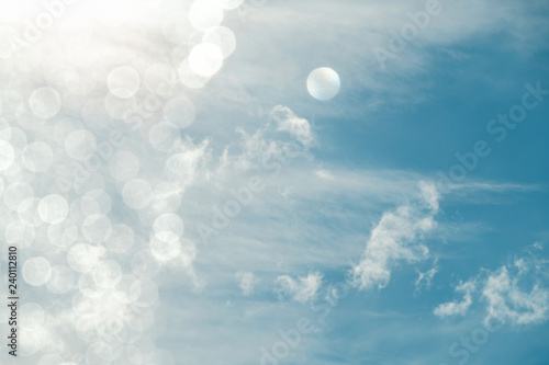 Blue Sky and Clouds on Sunny Day with Bokeh and Flair Lighting