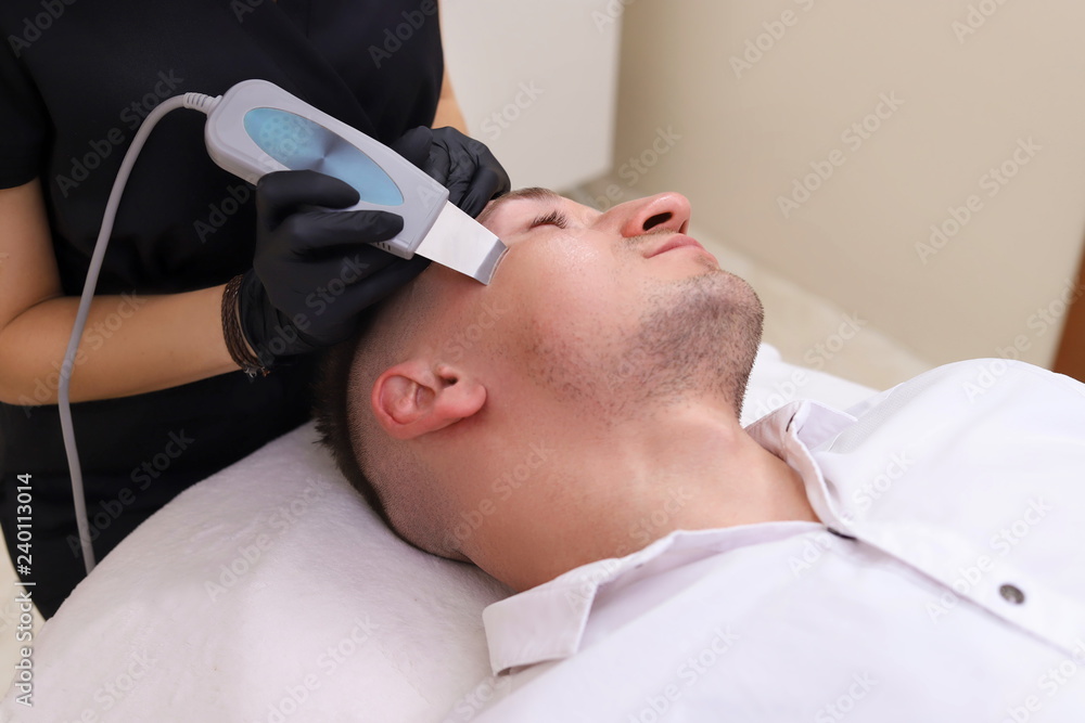 Fototapeta premium Ultrasonic face scrubber close up.