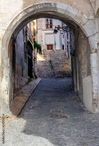 Lisbon - Portugal, access by a stone arch to the famous Alfama district