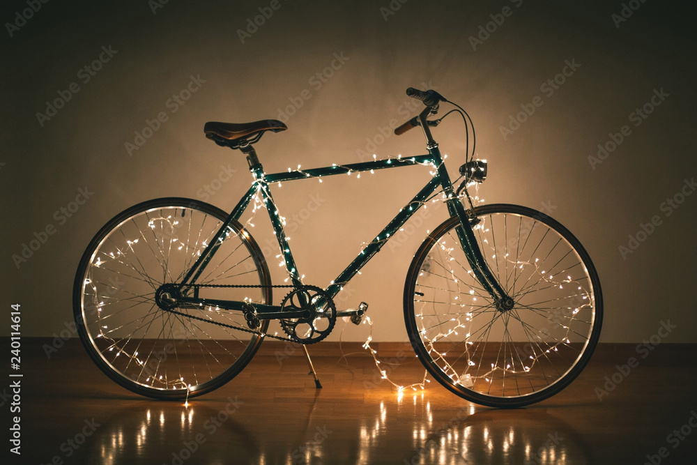 Fototapeta New Year bicycle decorated with Christmas lights