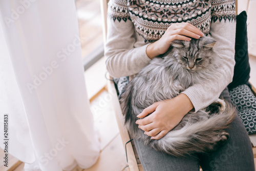 Girl relaxing with cat at home