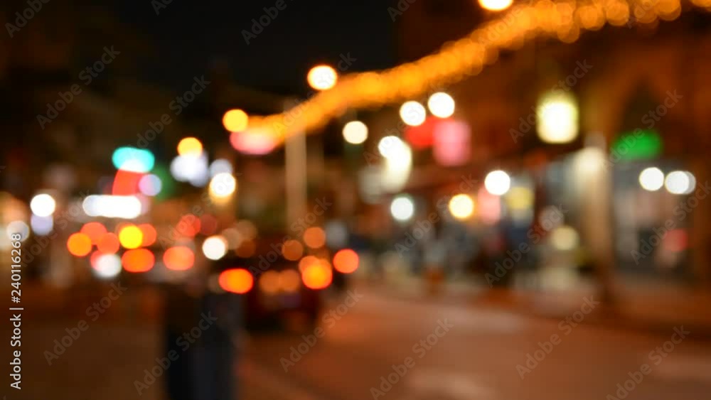 Motion of colorful diffused blurred and defocused twinkling light of city trafic. Defocused night traffic lights. Blur view of traffic in city at night Motion of colorful diffused blurred and defocused twinkling light of city trafic. Defocused night traffic lights. Blur view of traffic in city at night