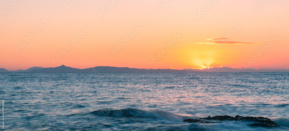 warm summer sunset at the sea