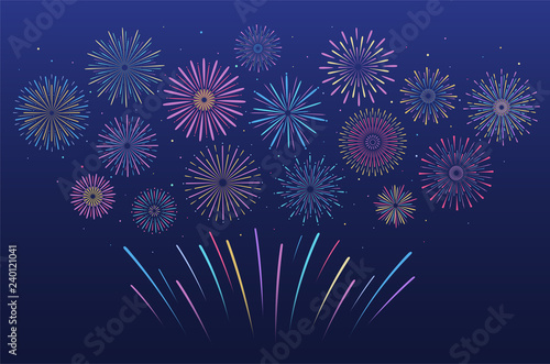 Festive multicolored fireworks in various forms.  Bursting pyrotechnic firecracker with stars and sparks.