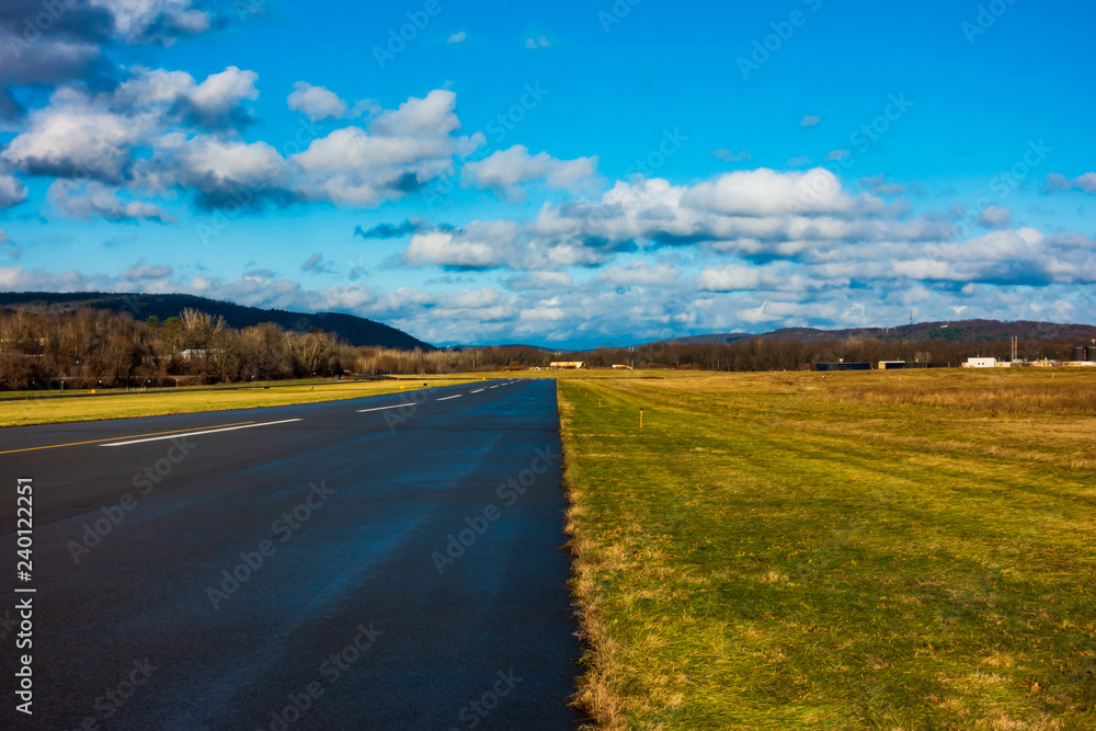 Runway, Blue Sky and Clouds